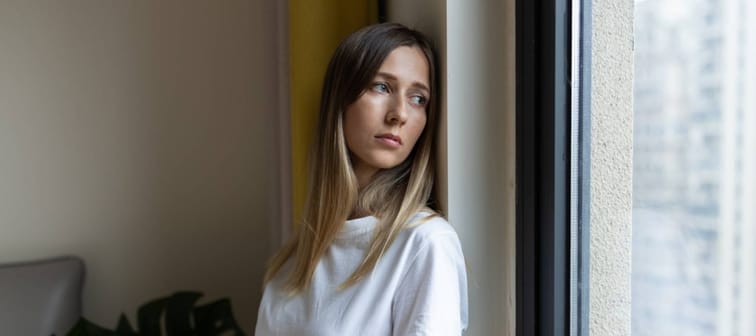 Unhappy young woman with blonde hair