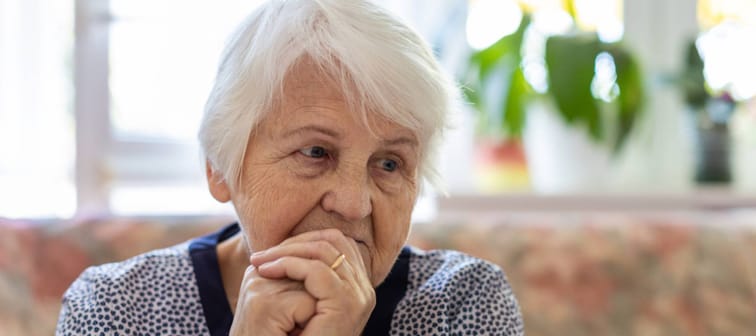 an elderly woman in a state of worry