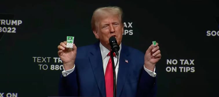 Trump holding two packs of tic tacs