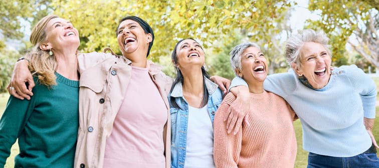 A group of older adults laughing and bonding.