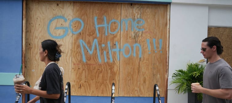 Hurricane Milton message on boarded window in Tampa