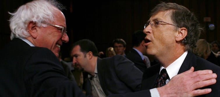 Bill Gates (right) speaks with U.S. Sen. Bernie Sanders after testifying before the Senate Committee on Health, Education, Labor and Pensions in Washington, D.C., March 7, 2007.