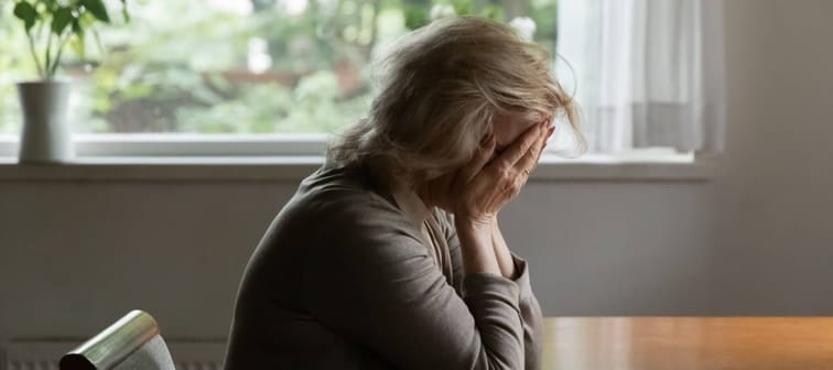 Unhappy old Caucasian woman