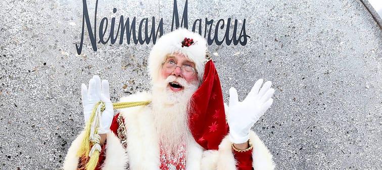 Santa Claus beneath a Neiman Marcus logo