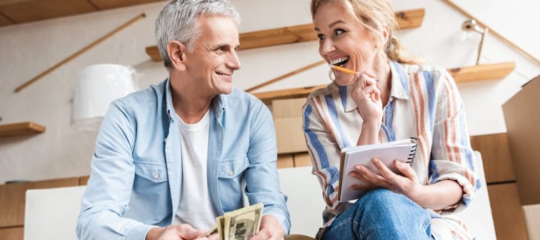 mature couple excited about money and planning finances