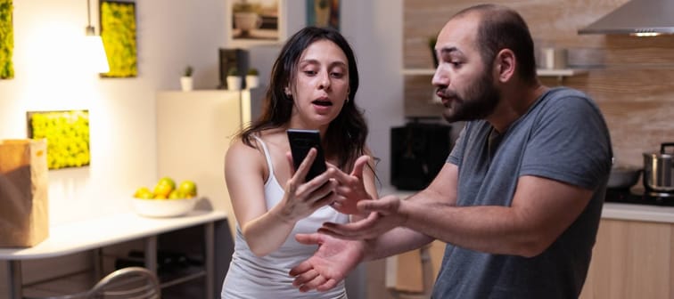 husband and wife arguing over a purchase