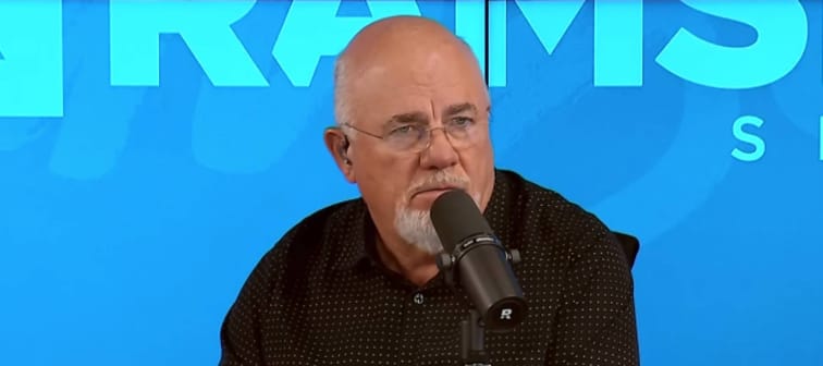 Dave Ramsey squints and looks incredulous on the set of his radio show.