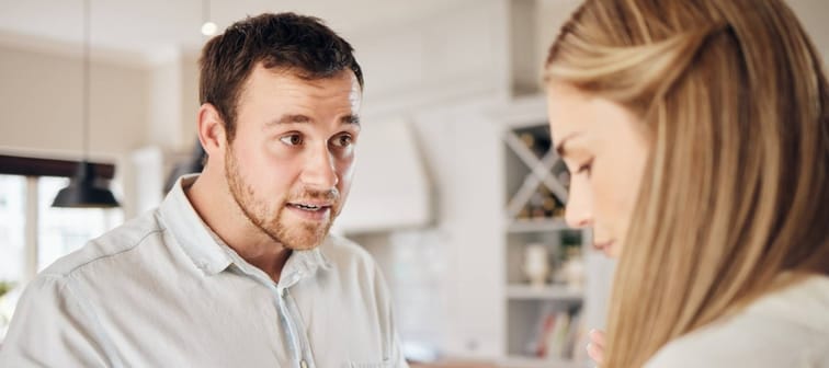 Couple arguing in an apartment.