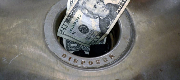Money going down the drain and into the garbage disposer