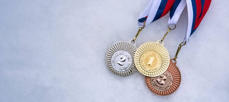 Gold silver and bronze medal, white snow background. Winter sport trophy for ski, hockey, nordic ski. Picture for winter olympic game in pyeongchang 2018