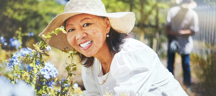 A mature woman gardening.