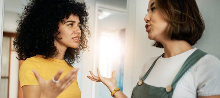 Two young women arguing.