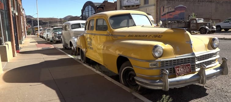 Erie Street in Lowell, Arizona, is lined with vintage cars.