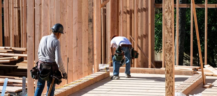 Workers building a house.