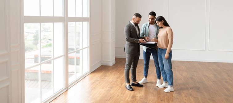 Realtor showing an apartment to prospective clients