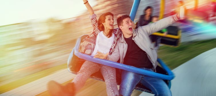 Beautiful, young couple having fun at an amusement park