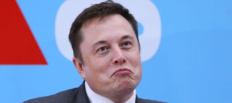 Elon Musk happy frowning