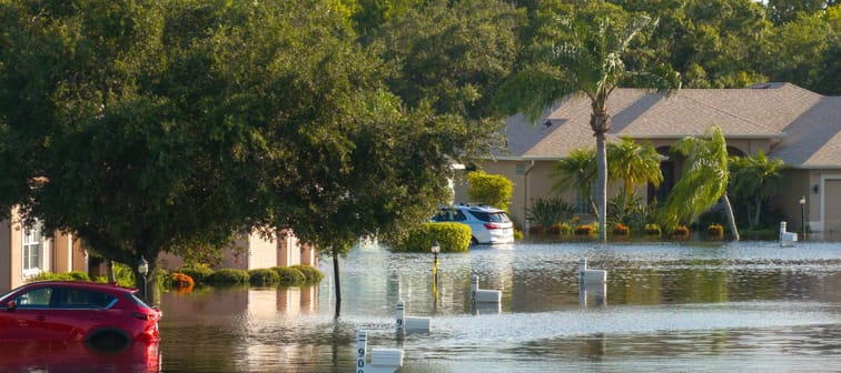 Flooded residential area with underwater houses and cars from hurricane Debby rainfall water in Laurel Meadows community in Sarasota, Florida. Aftermath of natural disaster in southern USA