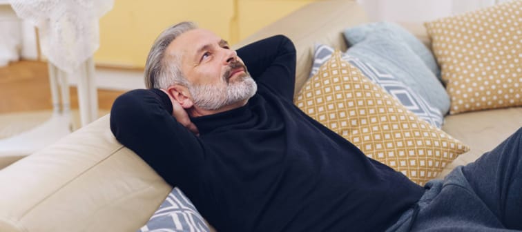 Relaxed middle-aged man looking up