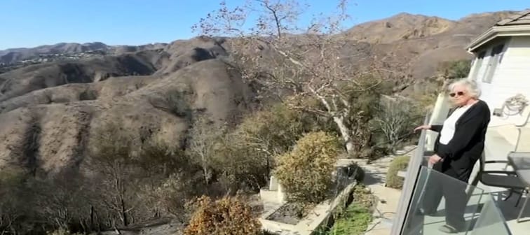 Susan Salser overlooks her Pacific Palisades property that was nearly destroyed by wildfire.