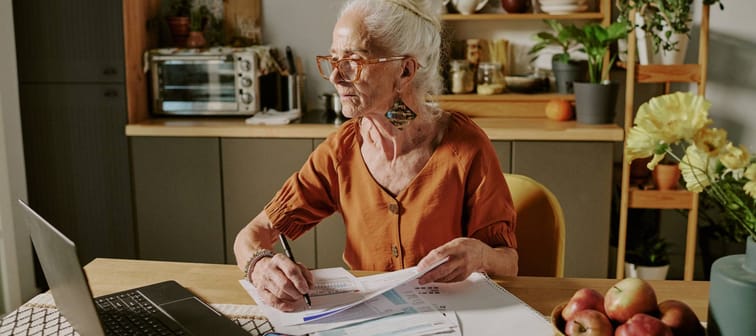 Elderly woman working on computer