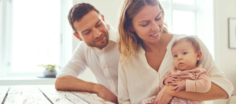 A young couple with their baby.