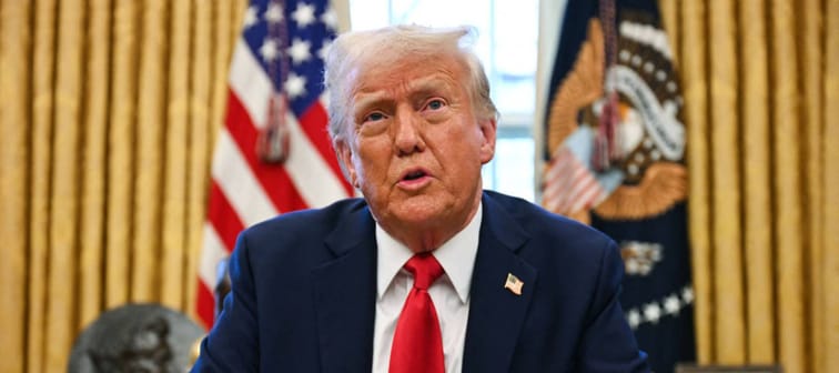 US President Donald Trump speaks to the press as he signs an executive order to create a US sovereign wealth fund, in the Oval Office of the White House.