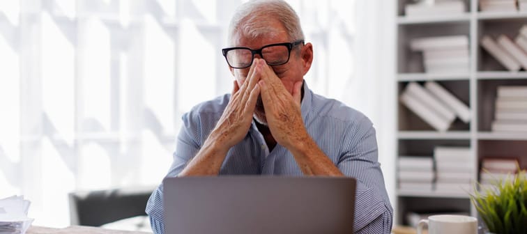 Man frustrated looking at computer