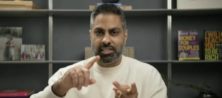 Ramit Sethi seen speaking animatedly in home office.