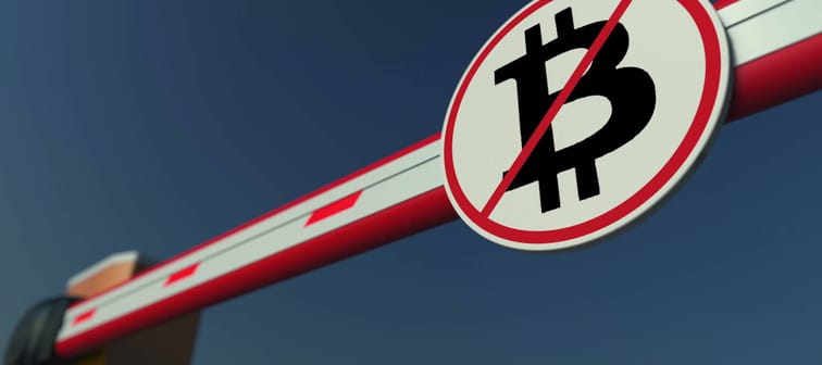 Barrier gate with Bitcoin prohibition sign. Cryptocurrency ban conceptual 3D rendering