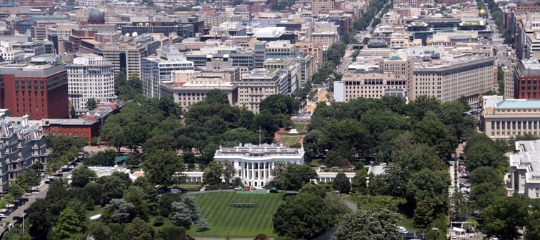 A scenic areal view of the White House and the surrounding buildings in Washington, DC.