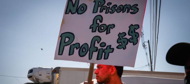 A man holds a placard as people protest outside Immigration Detention Center demanding an end to inhumane treatment on March 03, 2025 in Elizabeth, New Jersey.