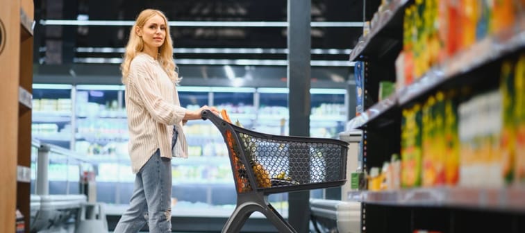 Woman in grocery aisle.