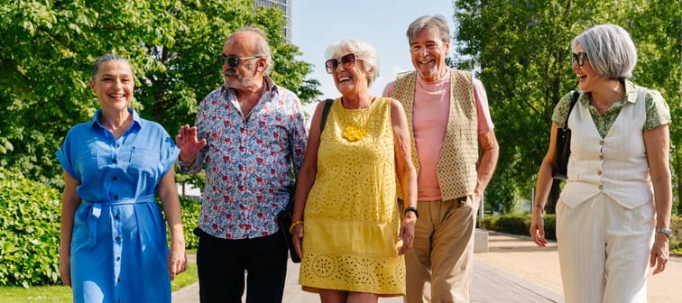 Happy people walking on the sidewalk