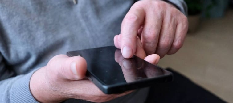 Older man on phone.