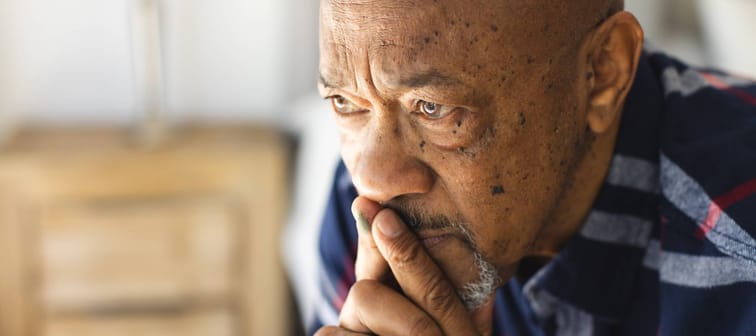 A pensive, older man.