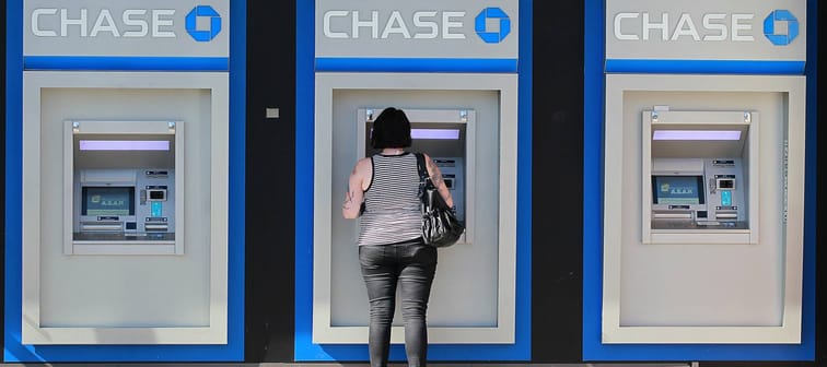 A customer uses an ATM outside of a Chase bank office in Oakland, California, Oct. 13, 2011.