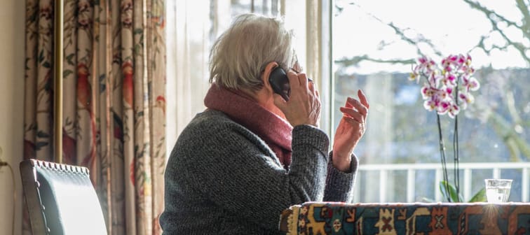 Older woman on the phone.