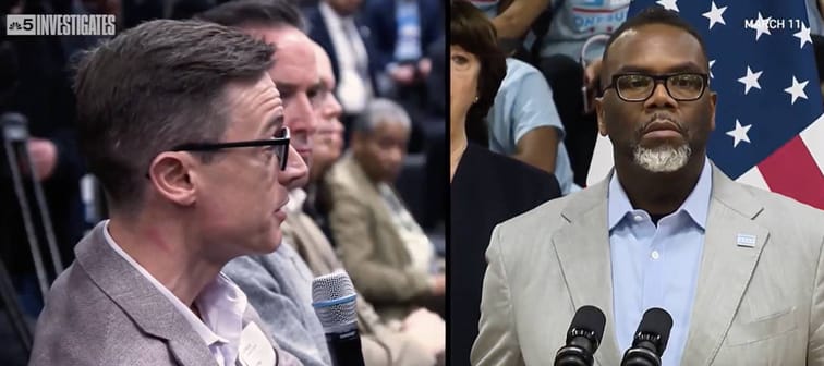 Concerned residents speaking at a conference regarding a vacant lot that was intended for migrants.