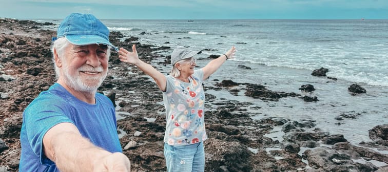 Elderly couple enjoying time at the beach