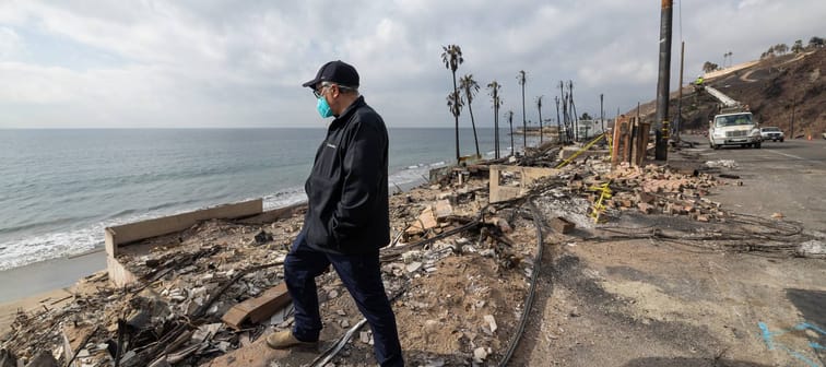 Neil Lerner visits the burned site of the oceanfront house on Pacific Coast Highway.