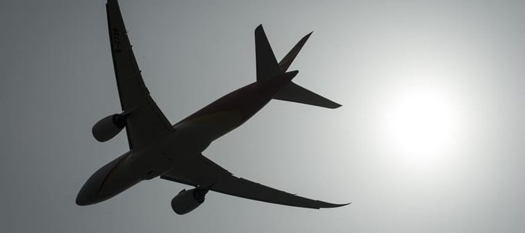 A plane is silhouetted as it takes off from Vancouver International Airport in Richmond, B.C., Monday, May 13, 2019. 