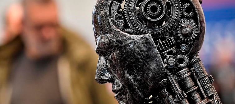 A group representing more than 150 Canadian tech companies is calling on the country to take a sensitive but speedy approach to artificial intelligence. A metal head made of gears symbolizes 
