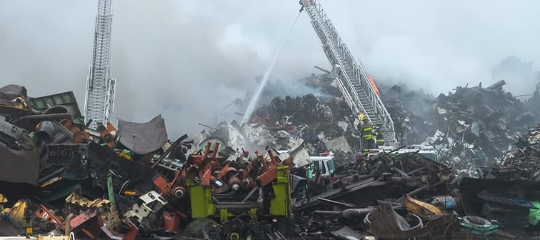 Firefighters battle a blaze on Thursday, Sept. 14, 2023, at a metal recycling yard along the harbour at Saint John, N.B. 
A task force has found a scrapyard, which sits in the middle of Saint