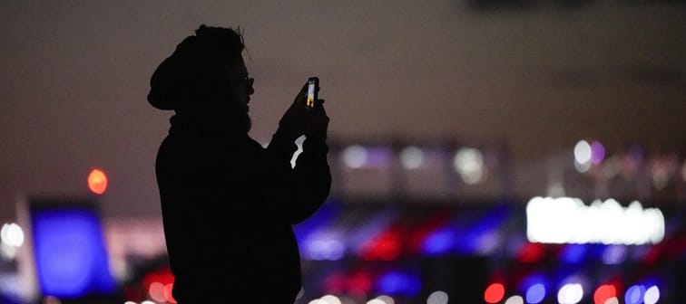 Canadian wireless companies collectively spent about $2.1 billion on chunks of 5G bandwidth in the federal government&rsquo;s most recent spectrum auction. A man uses a cell phone to capture 