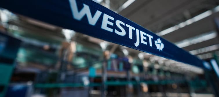 A WestJet logo is seen in the domestic check-in area at Vancouver International Airport, in Richmond, B.C., on Friday, May 19, 2023. The fallout from a mid-flight panel blowout on a Boeing Co