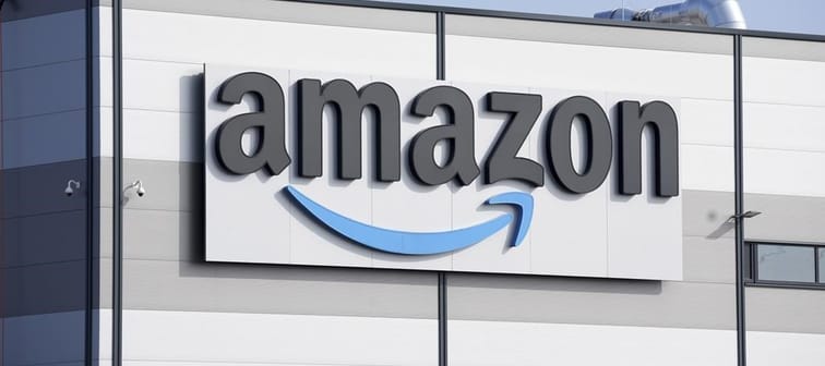 An Amazon company logo is seen on the facade of a company's building in Schoenefeld near Berlin, Germany, on March 18, 2022. Unifor says it&rsquo;s temporarily withdrawing its applications to