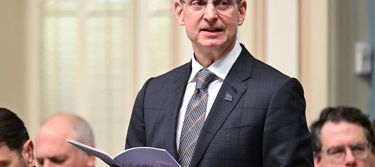 Quebec Finance Minister Eric Girard presents the provincial budget at the legislature in Quebec City, Tuesday, March 12, 2024. Quebec says it will harmonize its tax system with the federal go
