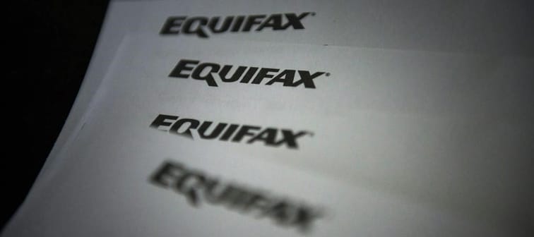 Equifax Canada says it's exploring how rent data could factor in to credit scores to help make credit and financial services accessible to more people. Equifax logos are shown on paper in Tor