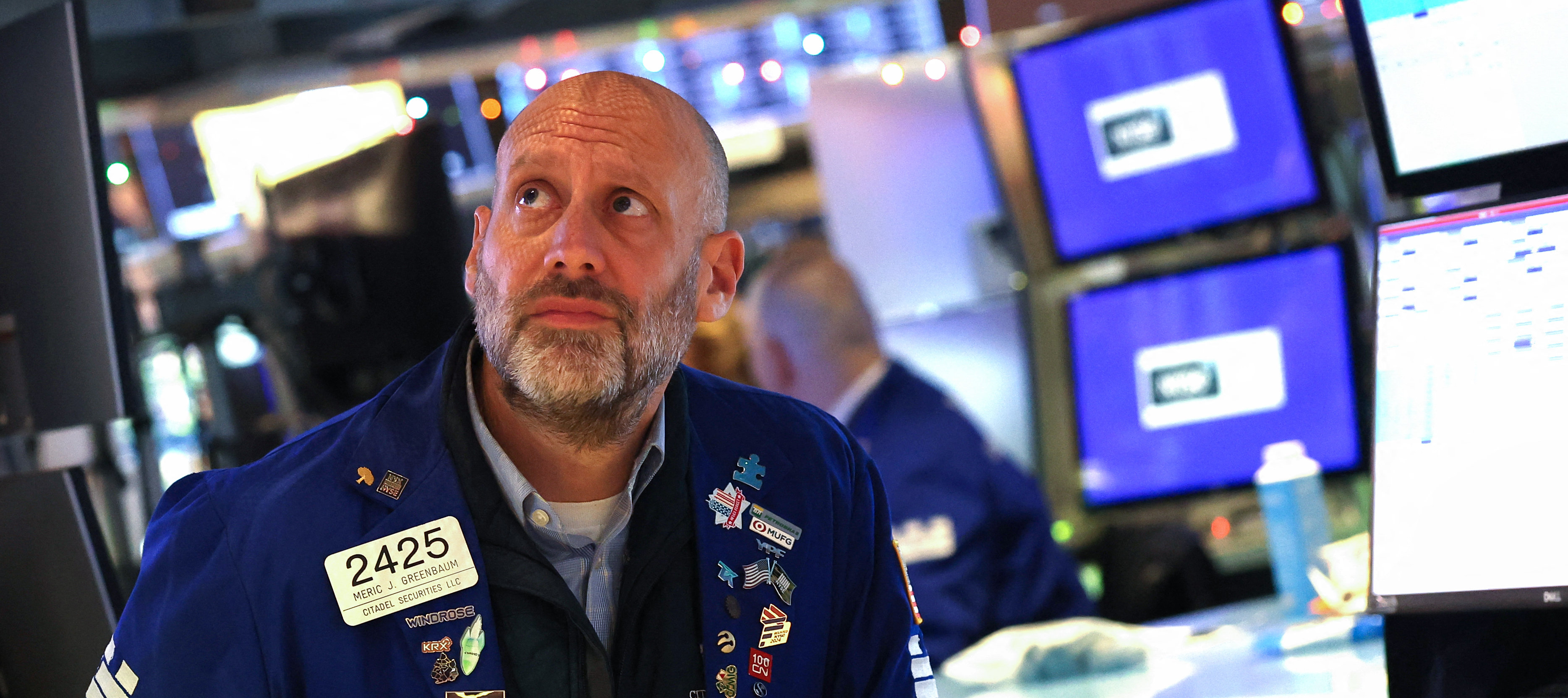 A trader works at his desk on the floor of the New York Stock Exchange after the opening bell in New York.